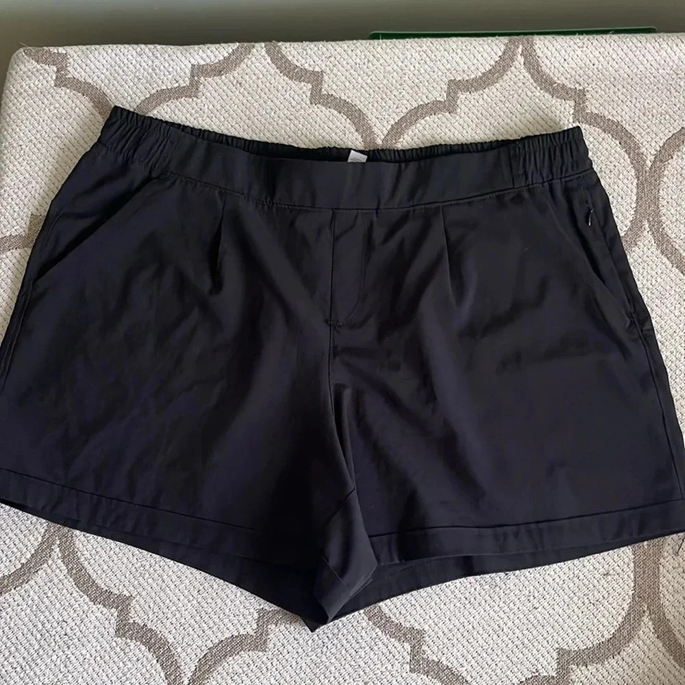 RBX active front pleat front pockets elastic waistband 4” inseam walking shorts